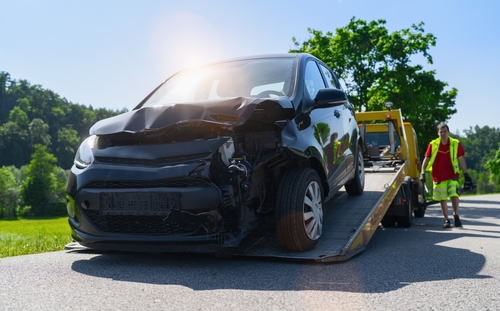 damaged-car-being-towed